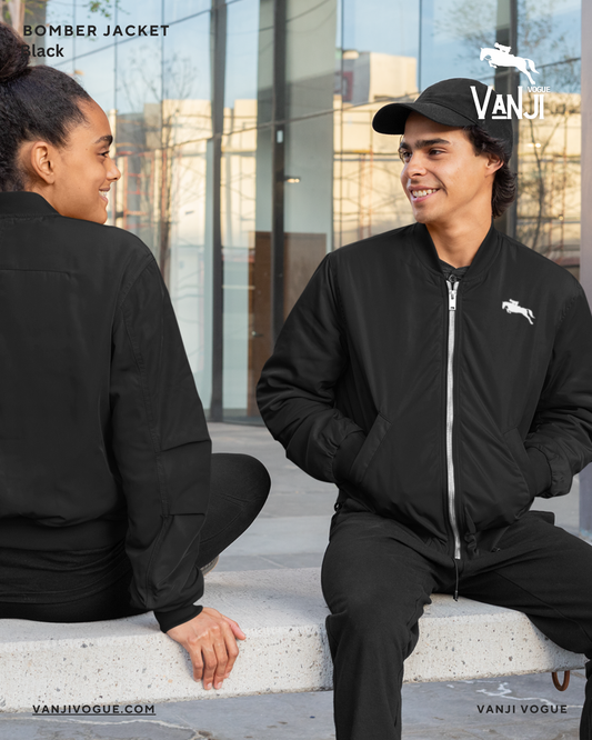 Men and women wearing lightweight bomber jacket for men and women in black sitting outdoors
