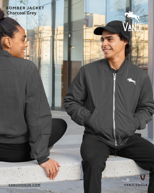 Lightweight bomber jacket for men and women in charcoal grey worn outdoors by smiling models