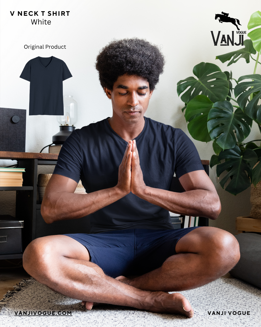 Men's navy v neck t shirt worn by man sitting cross-legged meditating indoors