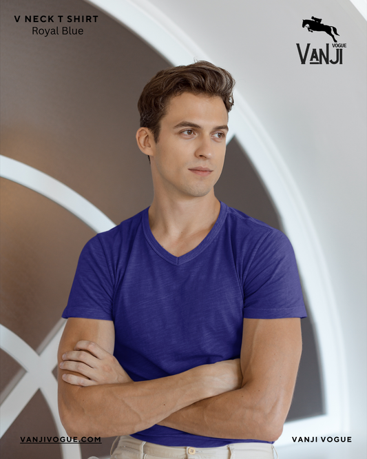 Man wearing a royal blue v neck shirt with short sleeves and a fitted style