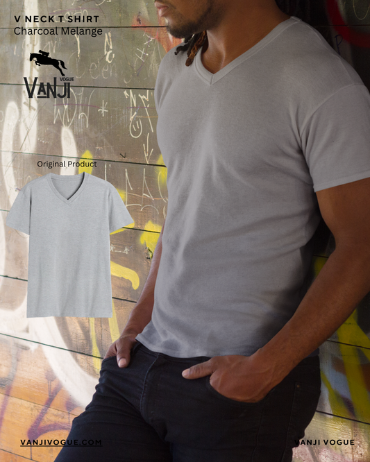 Grey melange v neck t shirt worn by man standing against graffiti wall in casual outfit